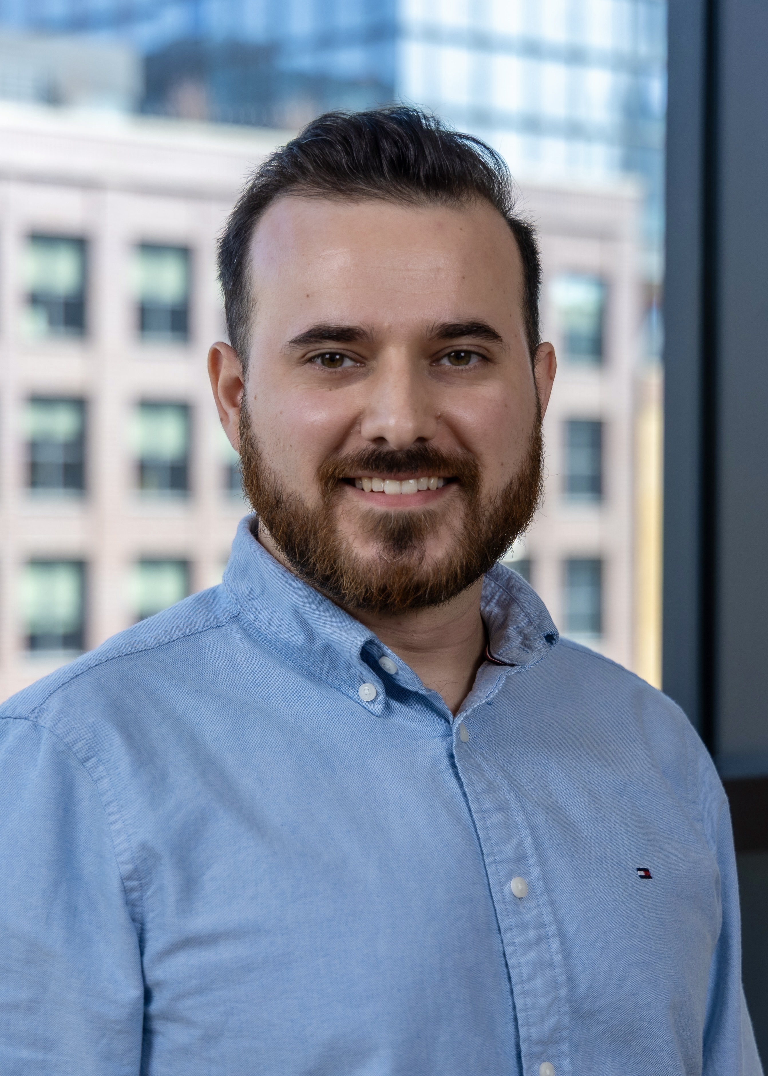 Photo of Chad wearing a blue button down shirt